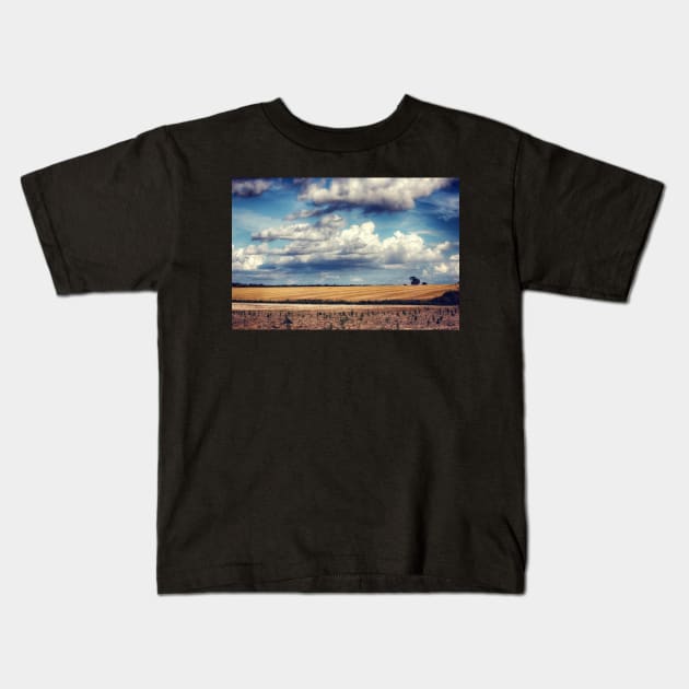 Clouds on a Saturday Kids T-Shirt by InspiraImage